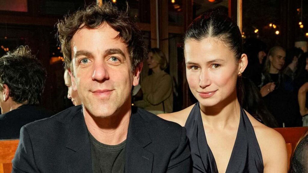 B.J. Novak and Delaney Rowe posing together at a public event in 2025, dressed in formal attire and smiling for photographers.