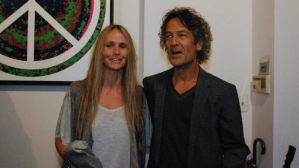 Billy Squier and Nicole Schoen posing for a photo at a music charity gala.
