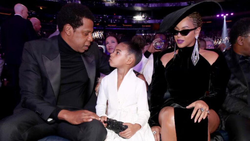 Blue Ivy Carter with parents Beyoncé and Jay-Z at event.