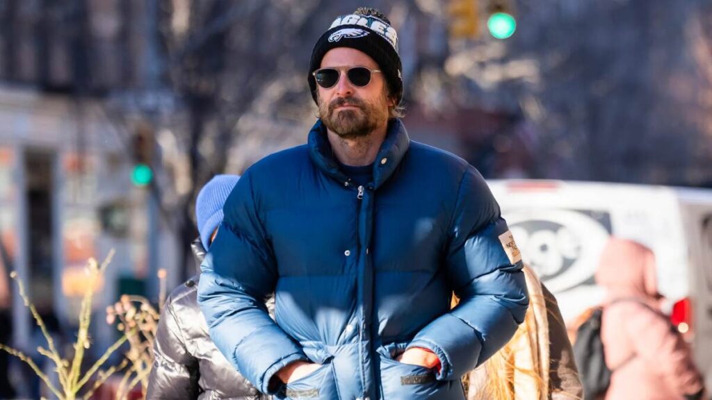 Bradley Cooper at a movie premiere, highlighting his success through acting, producing, endorsements, and business ventures.