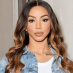 Brittany Renner smiling in a candid moment shared on social media.