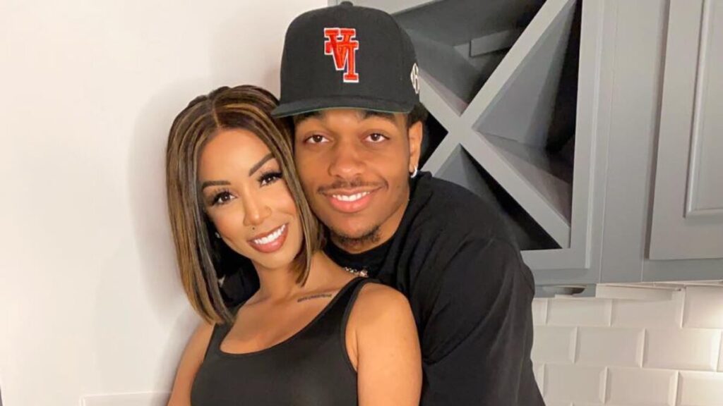 Brittany Renner and PJ Washington posing together as a couple before their split, smiling and dressed in casual outfits.