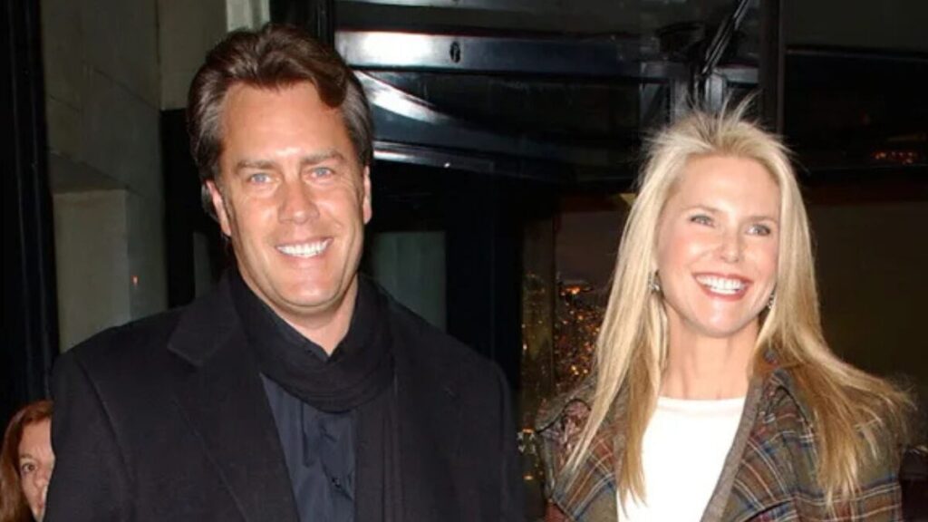Christie Brinkley and Peter Cook smiling together at a public event before their divorce