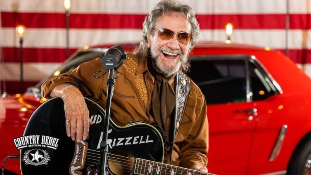 David Frizzell performing live on stage, earning through music royalties and concerts