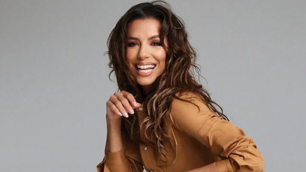 Eva Longoria posing for a promotional photo highlighting her career in television, film, and business.