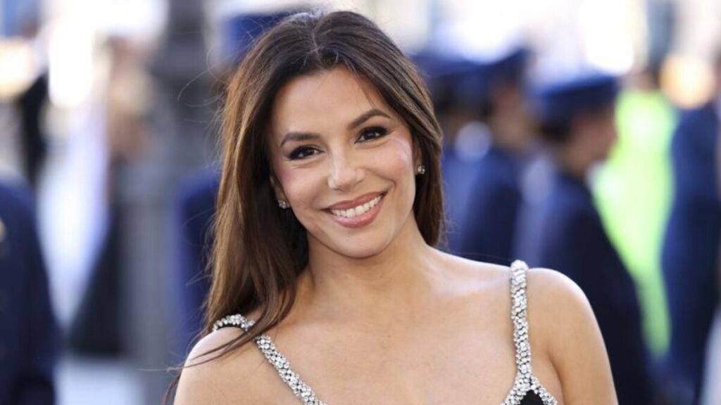 Eva Longoria at a business event, highlighting her income from acting, directing, endorsements, and entrepreneurship