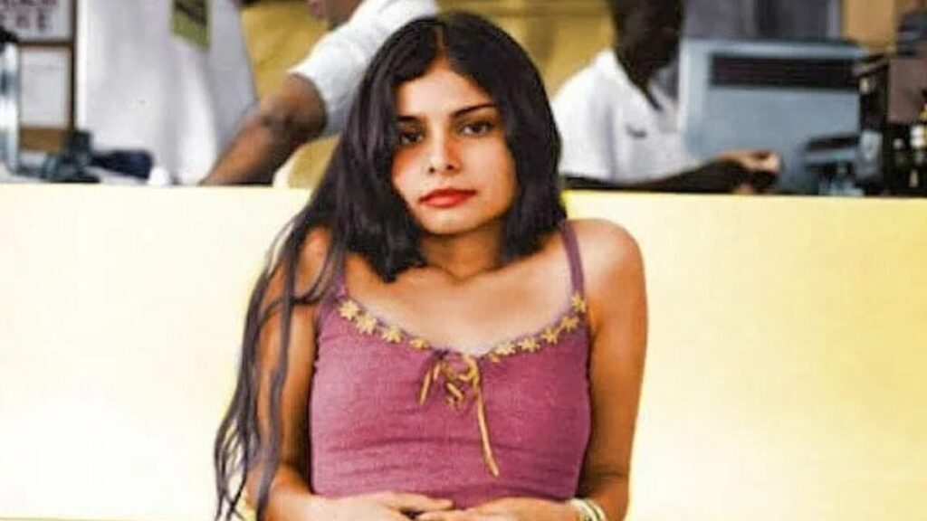 Stylized photo of Hope Sandoval with vintage aesthetic, surrounded by faded floral patterns.