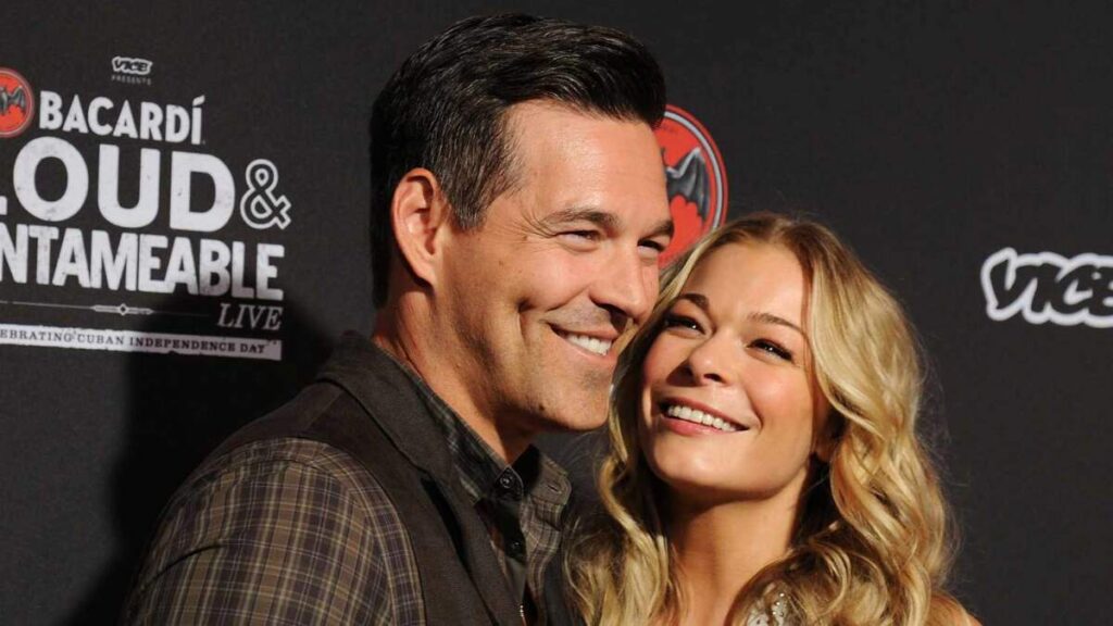 LeAnn Rimes and husband Eddie Cibrian posing at a celebrity event, highlighting their relationship and lifestyle.