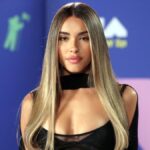 Madison Beer posing in a stylish outfit at a fashion event