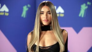 Madison Beer posing in a stylish outfit at a fashion event