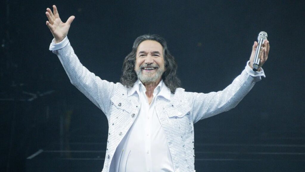 Marco Antonio Solís on stage with Los Bukis during their reunion tour.