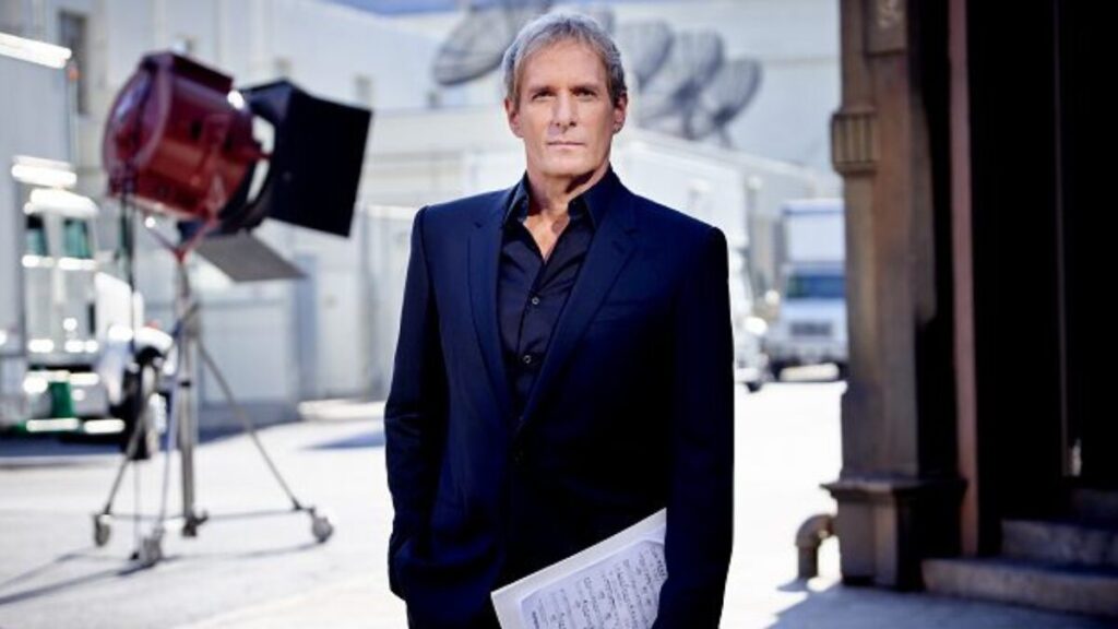 Michael Bolton in a promotional photo, representing his decades-long career in the music industry.