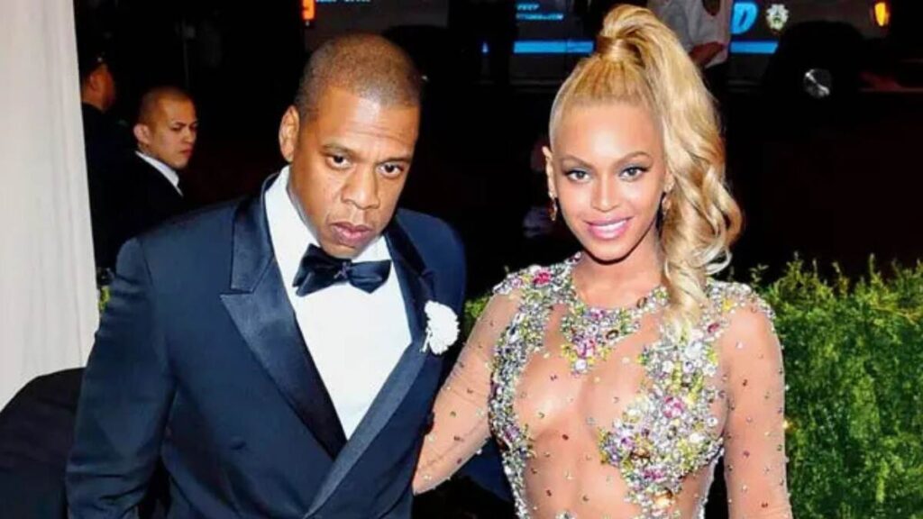 Beyoncé Knowles and Jay-Z at the 2024 Grammy Awards red carpet in designer fashion
