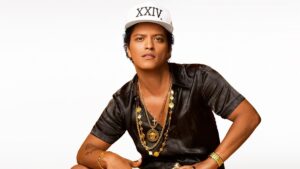 Bruno Mars posing in a stylish outfit for a promotional shoot