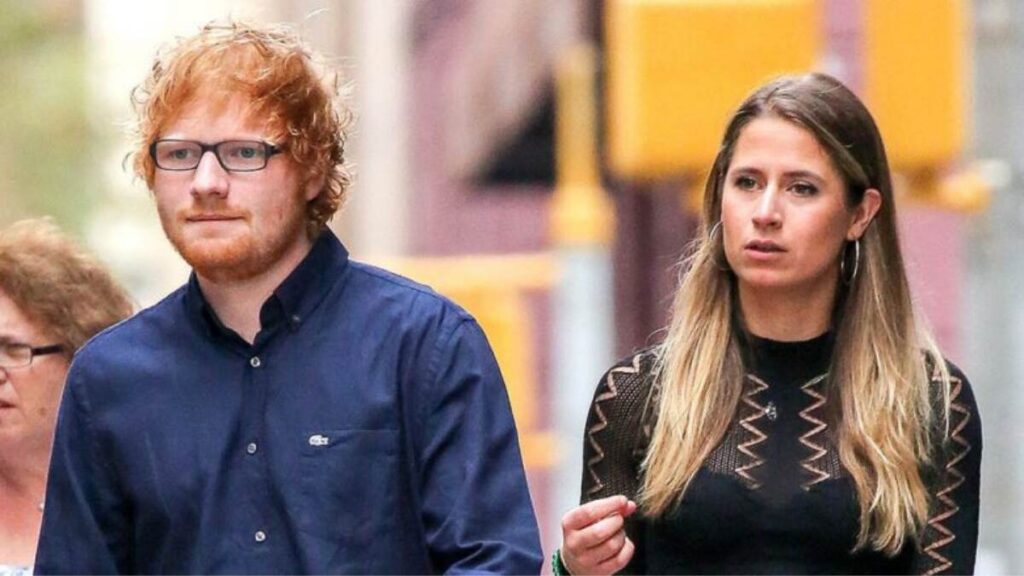 Ed Sheeran and wife Cherry Seaborn walking together on a city street