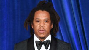 Jay-Z wearing a suit at a red carpet event