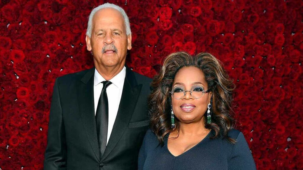 Oprah Winfrey and longtime partner Stedman Graham smiling together at a event.