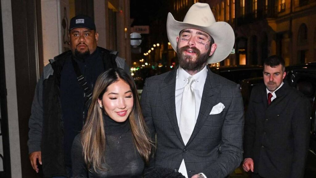 Post Malone and Christy Lee walking together on the street in early 2025