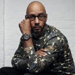 Swizz Beatz wearing designer streetwear in a professional photoshoot setting