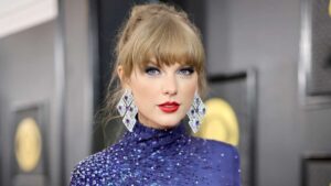Taylor Swift speaking at a press event for The Eras Tour concert film