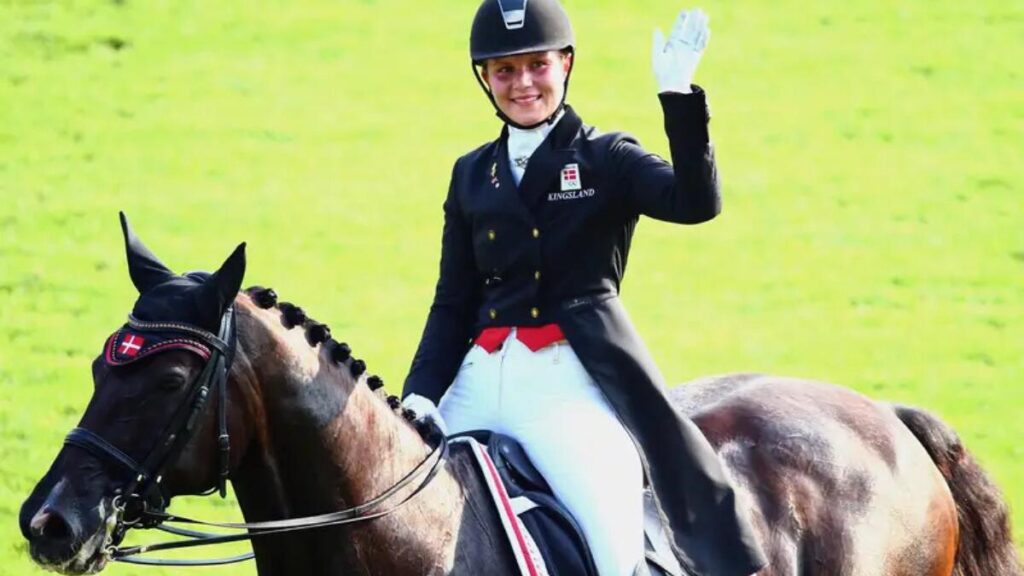 Anna Kasprzak riding a dressage horse during a training session in Denmark