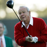 Arnold Palmer swinging golf club during PGA Tour match
