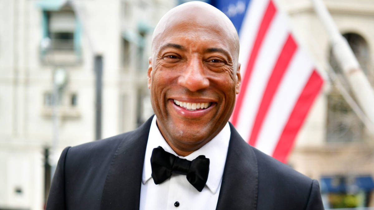 Byron Allen smiling at media event, 2025
