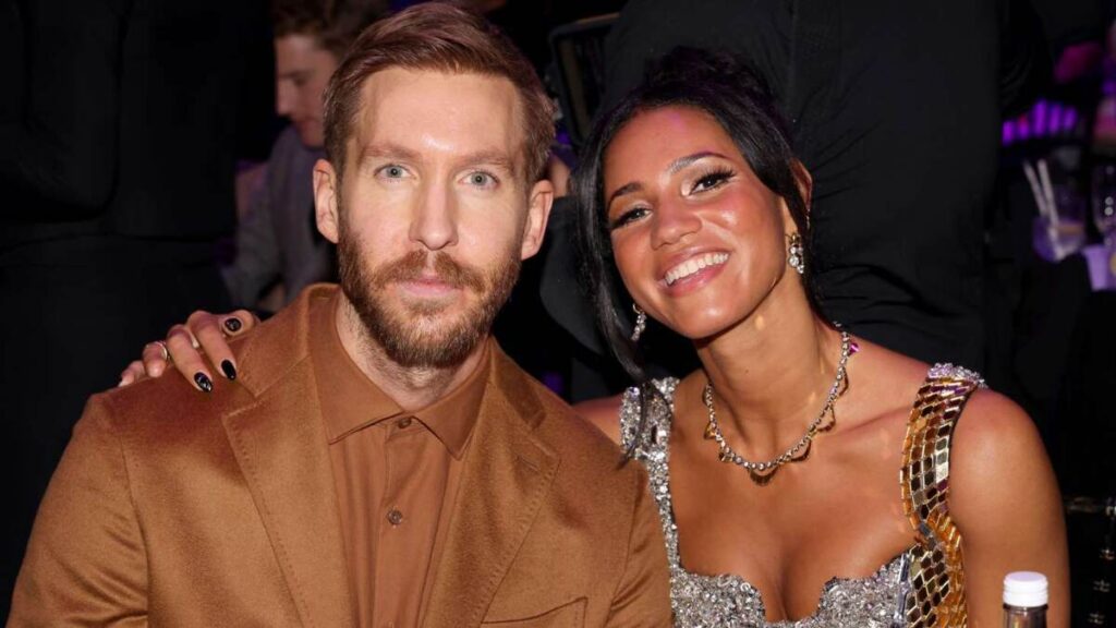 Calvin Harris and Vick Hope attend a red carpet event together in formal attire.