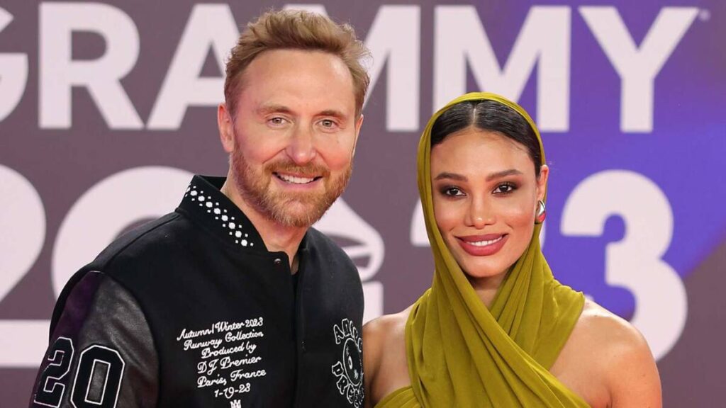 David Guetta and Jessica Ledon posing together at a Awards Show
