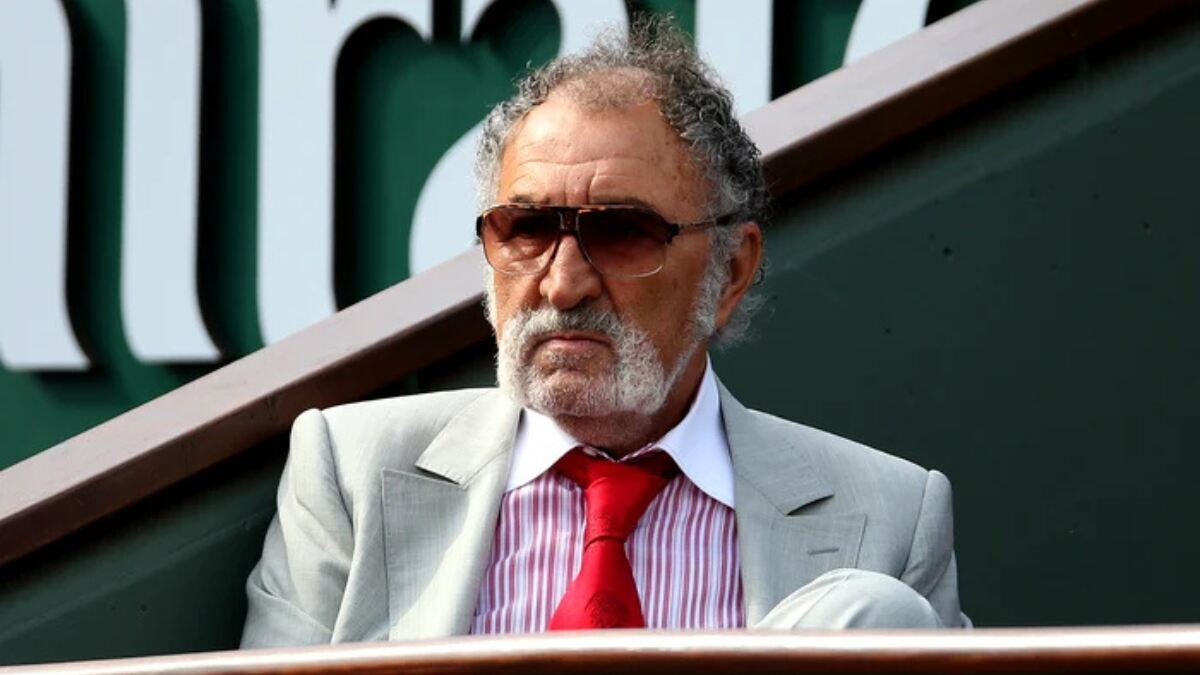 Ion Țiriac, Romanian billionaire and former tennis player, wearing a suit and glasses