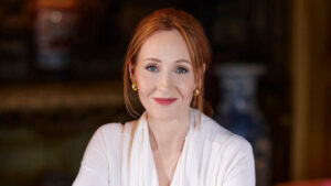J.K. Rowling outside her Edinburgh mansion, representing her luxury lifestyle and wealth