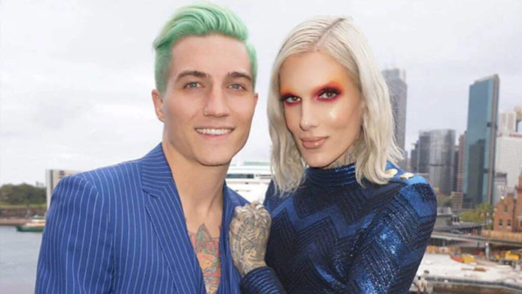 Jeffree Star and Nathan Schwandt smiling together at a public event before their 2020 breakup, showcasing their relationship during Jeffree's peak beauty influencer era.