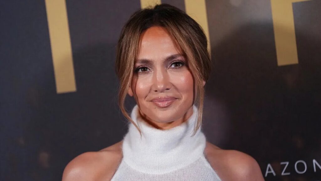 Jennifer Lopez at a red carpet event, representing her success as an actress, singer, and fashion icon