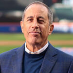 Jerry Seinfeld smiling in a promotional photo