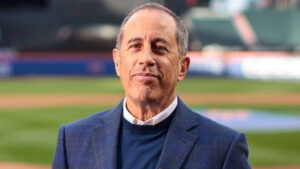 Jerry Seinfeld smiling in a promotional photo