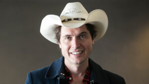 Kimbal Musk smiling in a professional headshot wearing his signature cowboy hat.