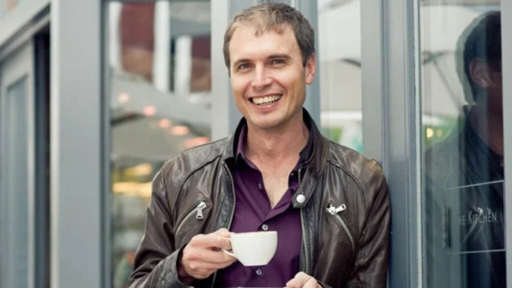 Kimbal Musk enjoying tea during a break, showcasing his calm, thoughtful approach to business and sustainability