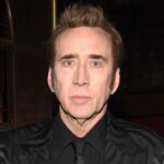 Close-up of actor Nicolas Cage smiling on the red carpet