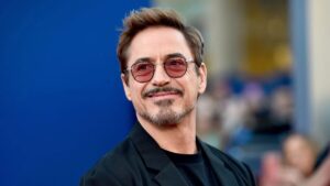 Robert Downey Jr. in 2025, wearing a tailored suit and sunglasses at a red carpet event