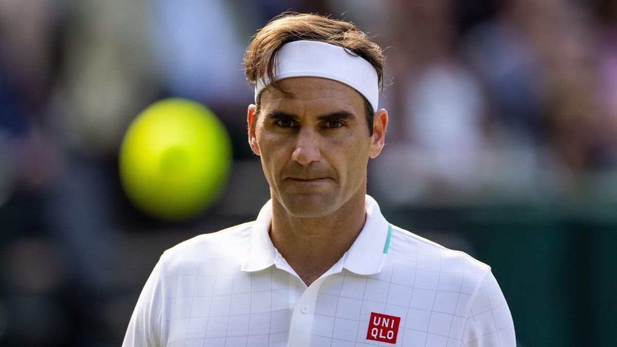 Roger Federer serving during a professional tennis match