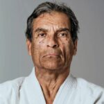 Rorion Gracie, Brazilian Jiu-Jitsu grandmaster and UFC co-founder, posing in traditional gi.