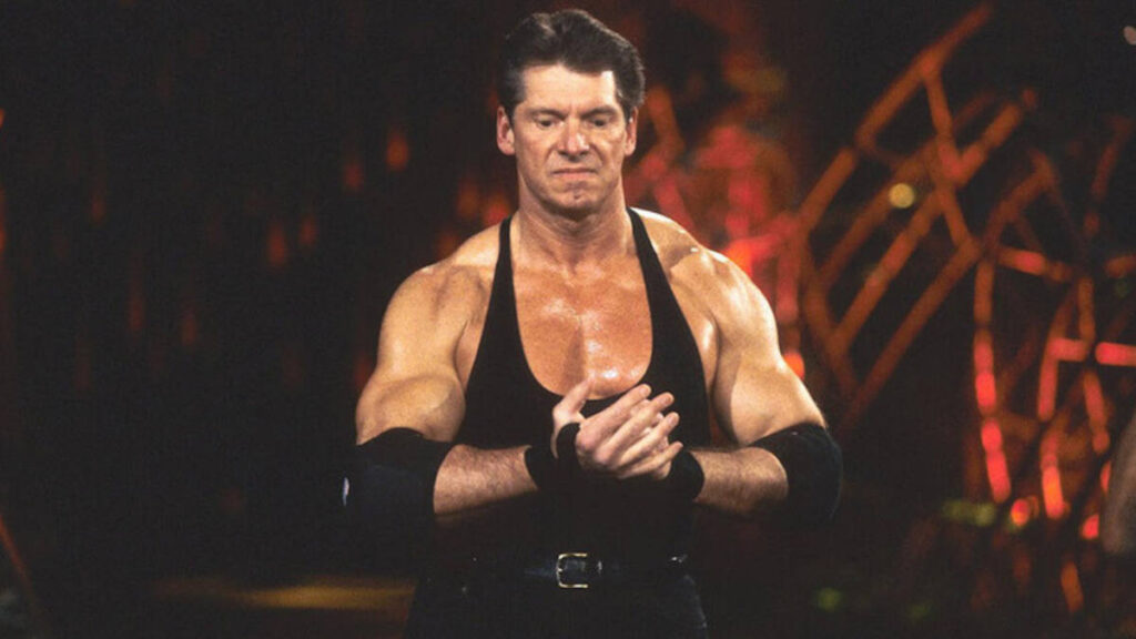 Vince McMahon entering WWE ring with signature walk