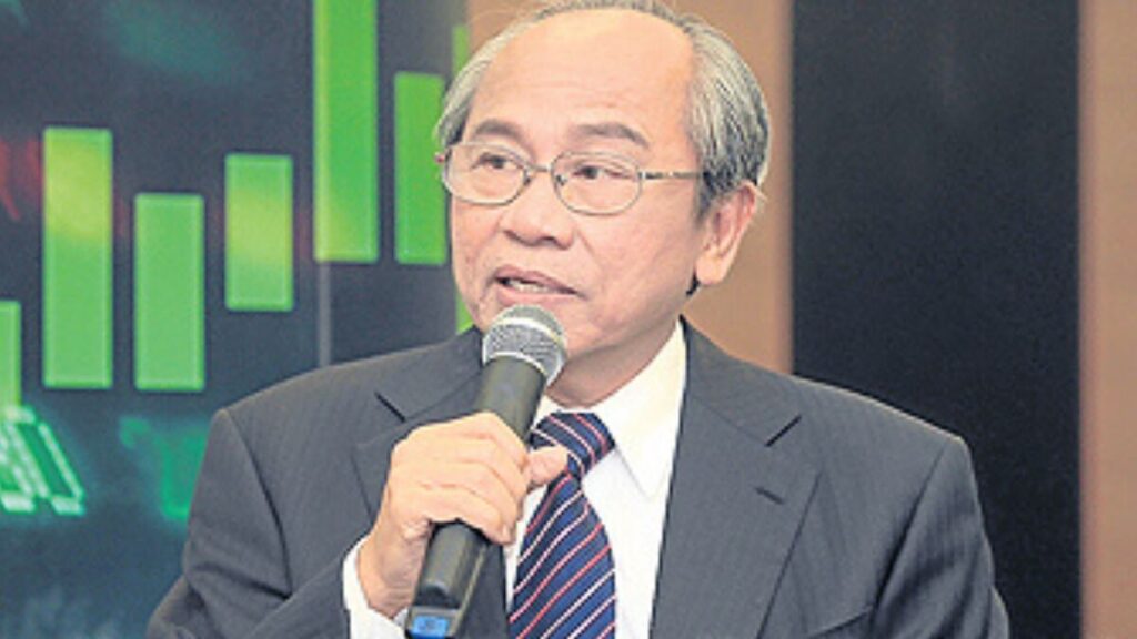 Wichai Thongtang in a formal suit, reflecting his private and professional demeanor.