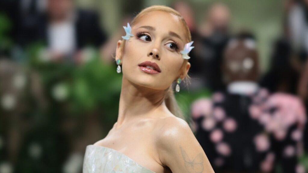 Ariana Grande at a red carpet event, representing her success in music and business ventures including REM Beauty, contributing to her rising net worth.