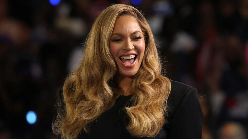 Beyoncé posing in a high-fashion outfit during a media photo shoot, symbolizing her success and growing net worth in 2025.