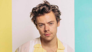 Harry Styles wearing a custom Gucci suit, highlighting his fashion collaborations and brand partnerships.
