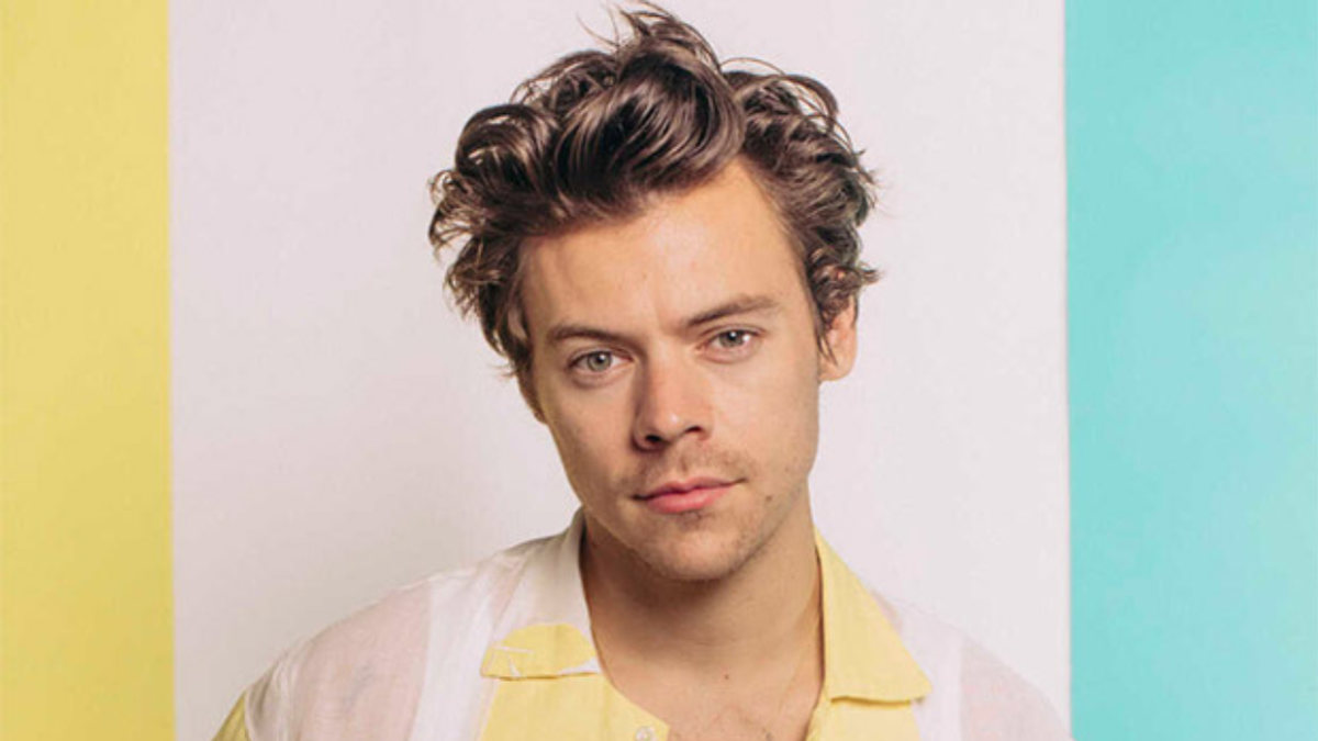 Harry Styles wearing a custom Gucci suit, highlighting his fashion collaborations and brand partnerships.
