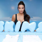Kim Kardashian making her money through business ventures, including SKIMS, reality TV, and strategic investments.