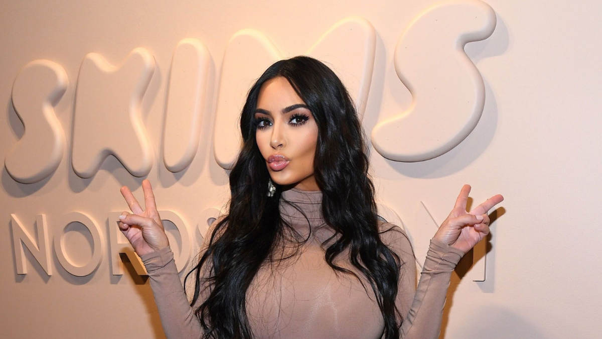Kim Kardashian wearing SKIMS shapewear in a promotional campaign shoot
