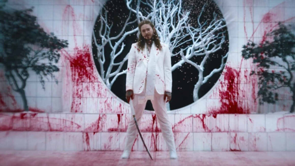 Post Malone performing “Rockstar” live, symbolizing his rise to streaming success and global fame